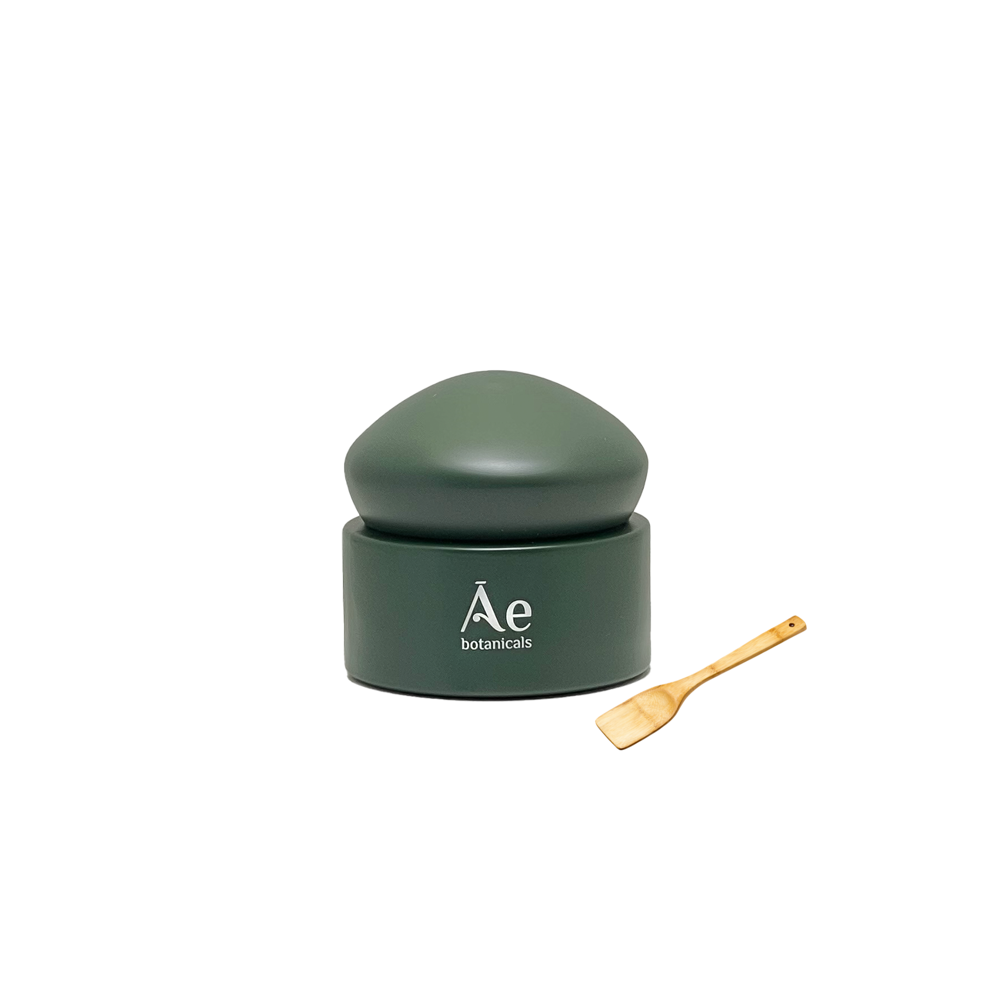 Green container with a wooden spoon on a white background