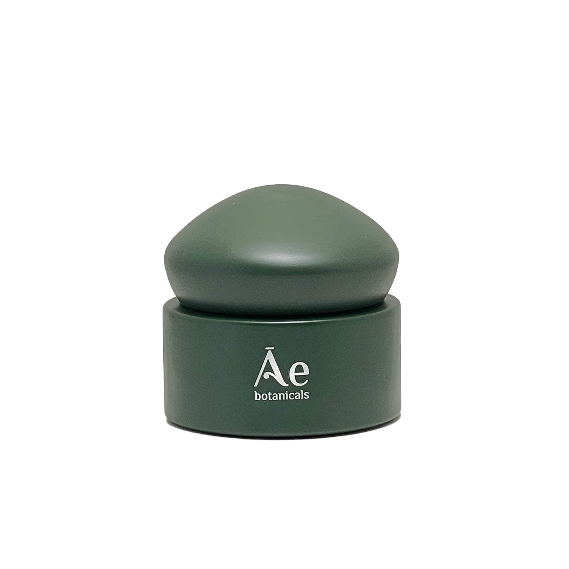 Green cosmetic container with lid on a white background, featuring the brand &