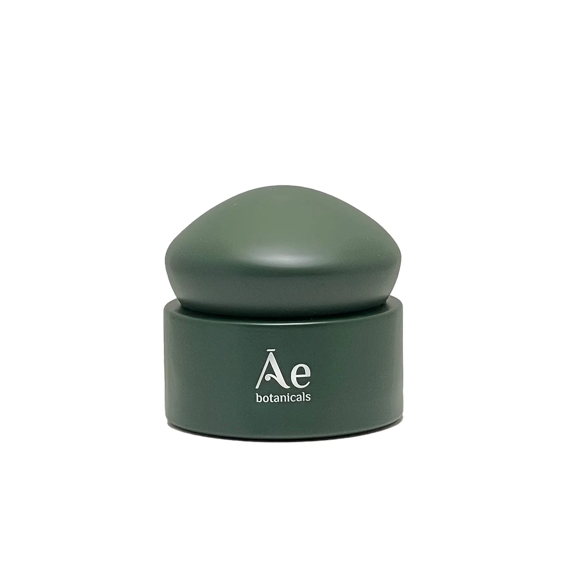 Green cosmetic container with lid on a white background, featuring the brand &