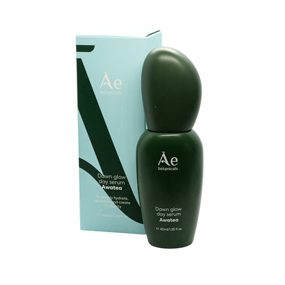 Green skincare serum bottle with packaging on a white background